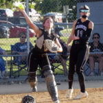 Abby Schreck throws to first after fielding an MMCRU bunt just in front of the plate. Charging in on the play was third baseman Kenna Bauer.