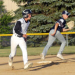 Gabe Moermond gets his lead off second base after having been held close to the bag by Unity Christian’s Austin Wierenga.